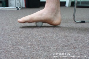 Use a small ball, such as a golf ball to massage the plantar fascia of the foot. For plantar fasciitis treatment.