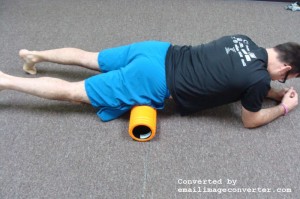 Place foam roller beneath the top of the hip bone. Lie with one hip on the roller. Opposite hip is off the foam roller.