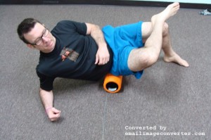 Sit on the foam roller. Turn your body to one side. Massage through the entire gluteal area from the crack of your butt to the outside of your hip, top of the pelvis to the top of the thigh.