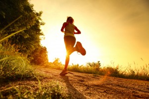 Runner on trail at sunset. Walking and running gait assessment